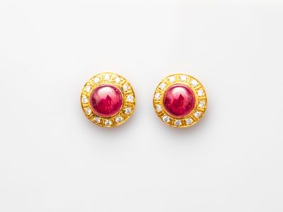 a pair of ruby and diamond earrings