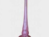 purple glass vase on a white surface with a white background