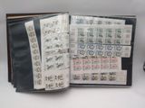 an open book with stamps on it on a table