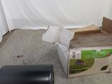 a box of toilet paper and a roll of toilet paper on the floor