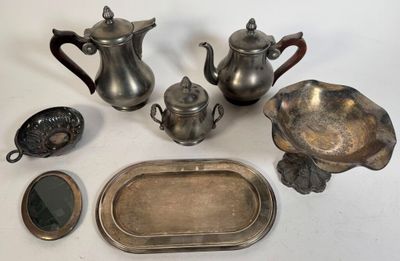 a lot of silver items that are on the table