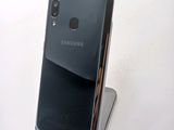 a close up of a cell phone on a stand