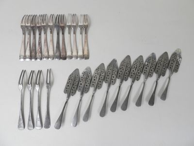 many forks and spoons laid out on the table