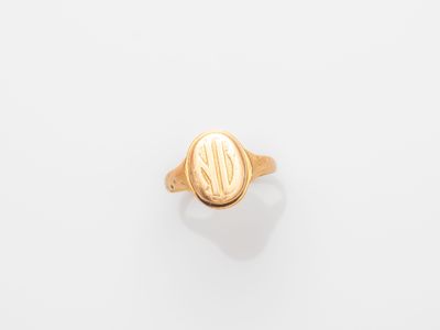 a gold signet ring with an oval design