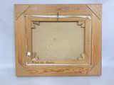 an old picture frame with a picture of a man and a woman