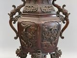 a large vase that is on a stand on a white background