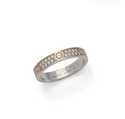 a close up of a ring with diamonds on a white background