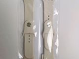two apple watch bands in the packaging on the table