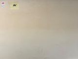 a refrigerator that is sitting in the corner of a room