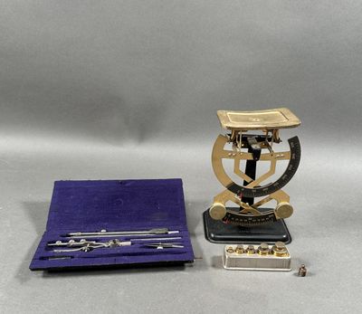 a silver and gold object with a purple case