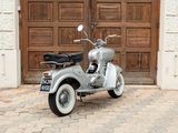 a scooter that is parked in front of a door