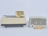 a small radio and a toaster sitting next to each other