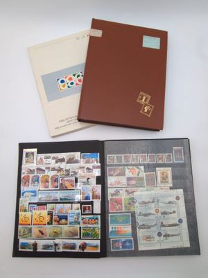 three different types of stamps are in a folder on a table
