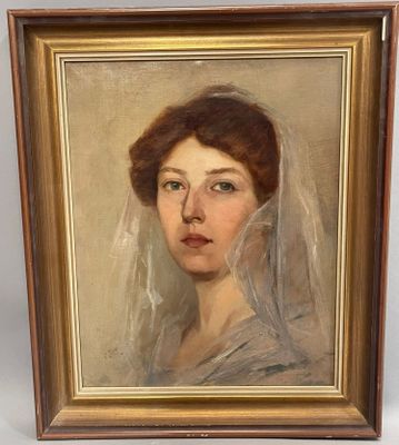 un tableau représentant une femme portant un voile, dans un cadre doré