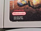 two nintendo game cartridges sitting on top of each other