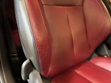 a close up of a red leather seat in a car