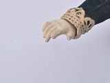 a doll that is holding something in her hand