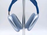 a pair of headphones on a stand on a white background