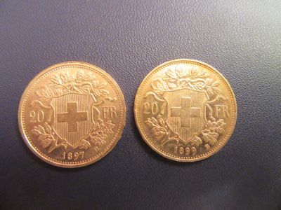 deux pièces d'or sur lesquelles figure un blason