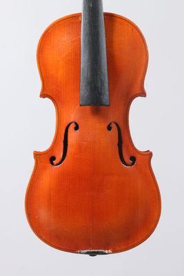 an orange violin with a black bow on a white background
