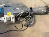 a drill that is laying on the ground