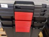 a black and red tool box sitting on a pallet