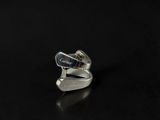 sterling silver ring with a curved band and a black background