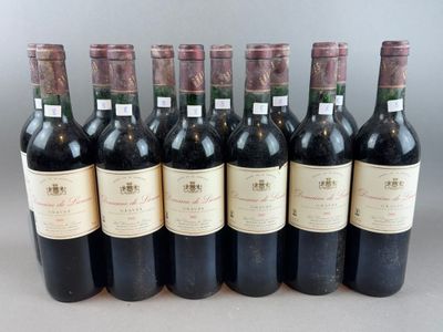 six bottles of wine are lined up in a row on a table