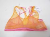 yellow and pink sports bra top with pink straps on a white surface