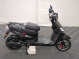 a scooter that is parked on a checkered floor