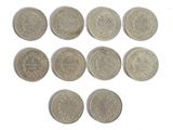 six different types of silver coins on a white surface