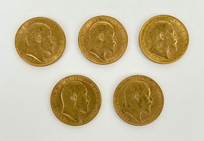 four gold sovereigns, one of which is a sovereign and four of which are in different positions