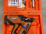 an orange tool box with a stapler and a stapler in it