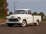 a white truck that is driving down the street