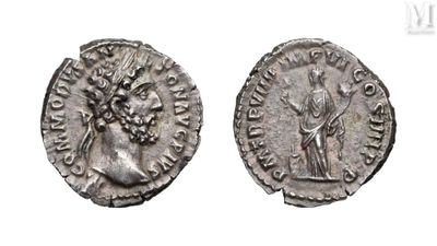 a silver coin with an image of a woman and a man on it
