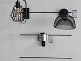 a wall mounted light that is hanging on the wall