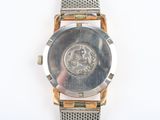a close up of a wrist watch on a white surface