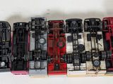 a lot of toy trains sitting on a white surface