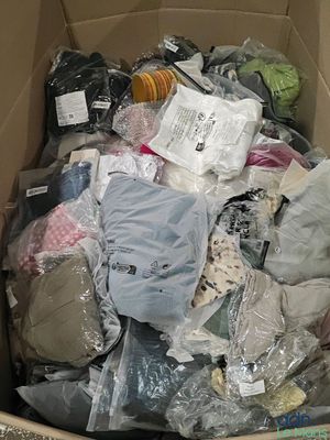a cardboard box full of clothes and other items