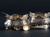 pair of silver plated owl figurines with gold accents
