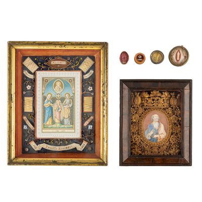 two framed pictures of the virgin and child are displayed in a wooden frame
