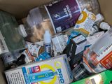 a box full of toothbrushes, toothpaste, and other hygiene products
