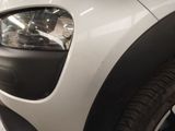 a close up of a car ' s headlight and front bumper