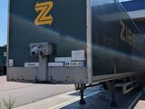 a semi truck that is parked on the side of the road