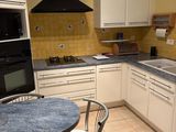 a small kitchen with a table and chairs in it