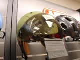 helmets on display on the wall of a store