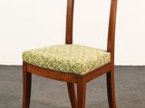 an image of a wooden chair with a green upholstered seat