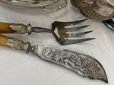 a table with silverware and silverware on it