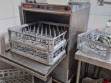 a kitchen with a bunch of dishes in the dishwasher