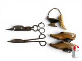 four pairs of scissors and a pair of scissors on a white surface